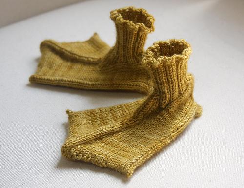 Knitted slippers in the shape of webbed albatross feet.

Designer and picture - unknown.