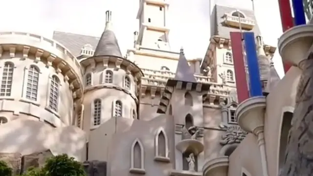 An architect builds a miniature Disneyland in his backyard