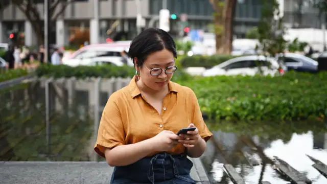 Gen Z workers are stressed out by email, and they do the sweetest thing with their phones