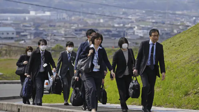 Japanese officials inspect 2 factories that make health supplements that are linked to 5 deaths