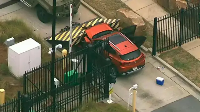 A man is in custody after he rammed his car into the FBI building