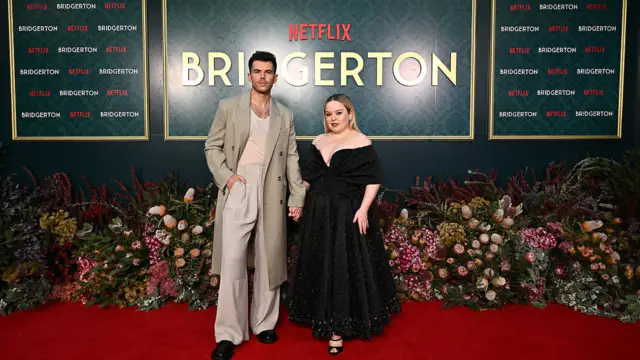 Bridgerton's starNicola Coughlan is wearing a black dress