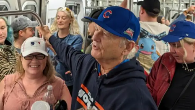 Bill Murray is riding the subway after the Cubs win over the Mets