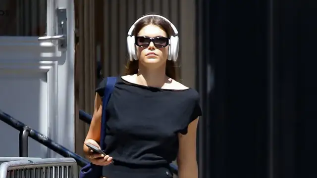 Kaia Gerber shows off her taut tummy as she steps out in NYC