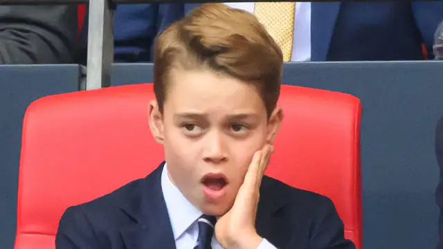 Prince George yawns and looks upset at the FA Cup final