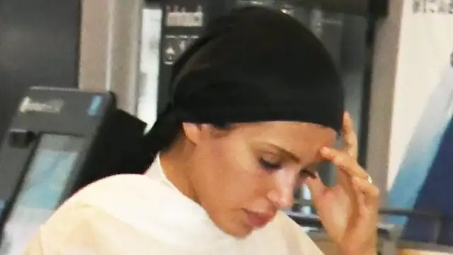 Bianca Censori COVERS up arriving to Japan with husband Kanye West