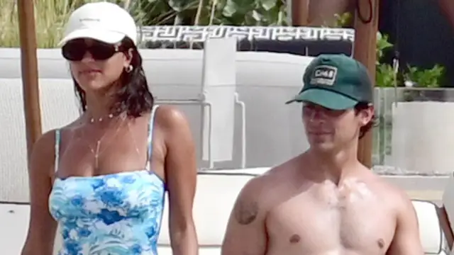 There is a mystery brunette in Greece with Joe jonas