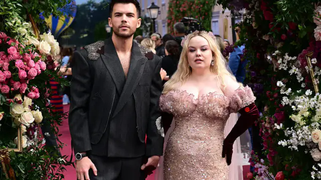 At the Bridgerton premiere, Nicola Coughlan holds hands with a man
