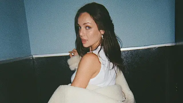 A woman shows off her bottom in a pair of tiny shorts