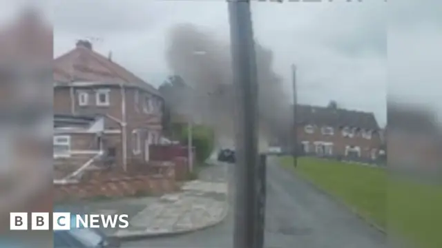 A man is pulled from the rubble of a house that has been destroyed in an explosion