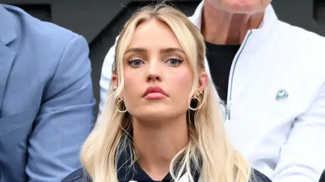 The girlfriend of a tennis player blames the media for overblowing her social media posts