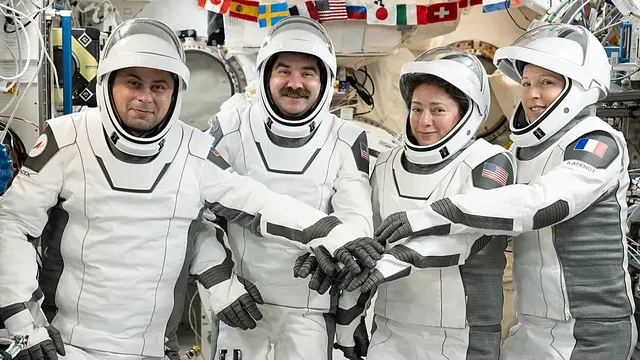 Four astronauts from US, France, and Russia return to Earth after eight months in space
