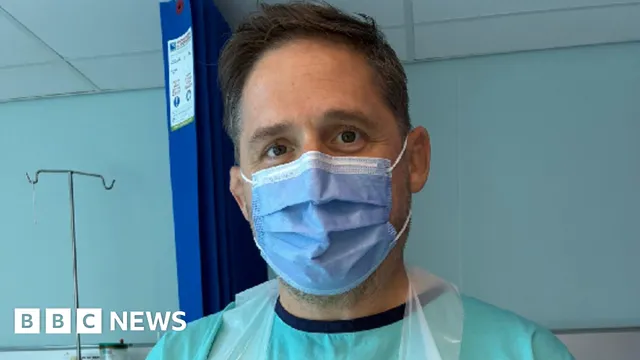 Rhys Thomas holds his own heart after life-saving transplant surgery