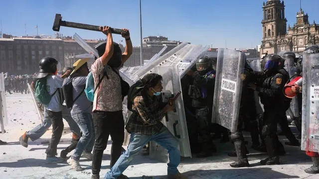 Protests escalate as masked rioters clash with police in Mexico City
