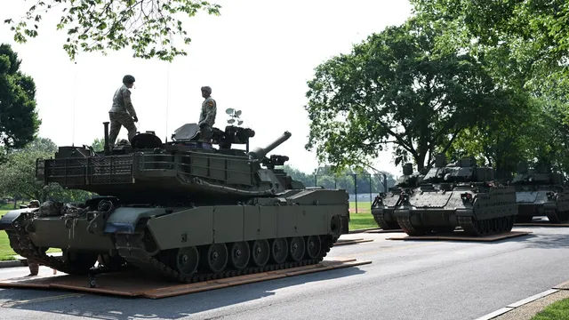 Woman killed by truck transporting military tank in DC