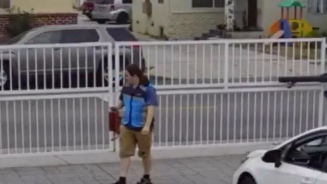 Amazon driver hurls racist insults after getting stuck behind gate