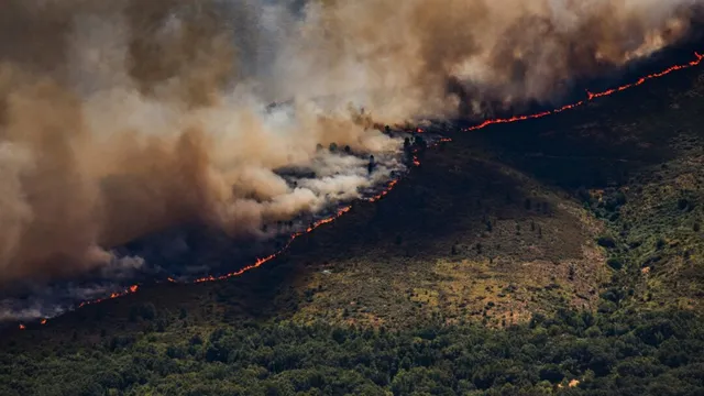 Firefighters struggle against massive wildfire in Spain