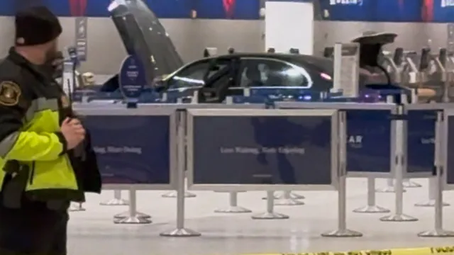 Driver in custody after crashing into Detroit airport terminal injuring six
