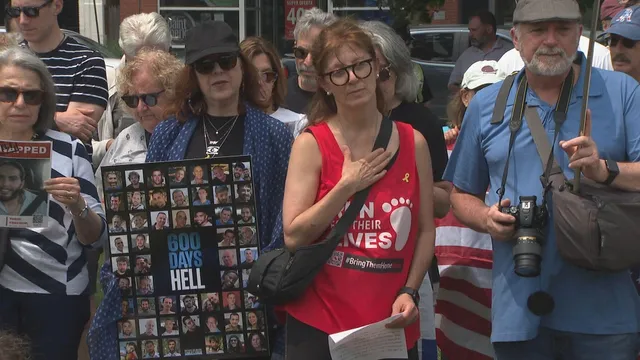 Dozens gather in Massachusetts vigil for hostages after Colorado attack