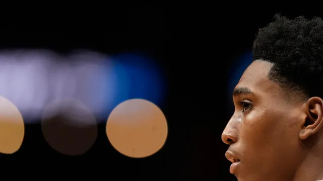 Judge delays key decision on NCAA athlete payments settlement