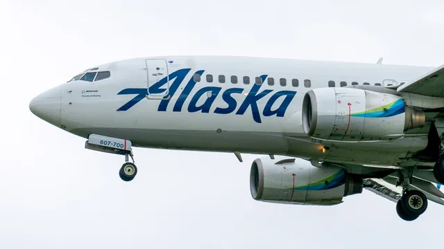 Passenger attempts to open airplane door mid-flight, causing chaos