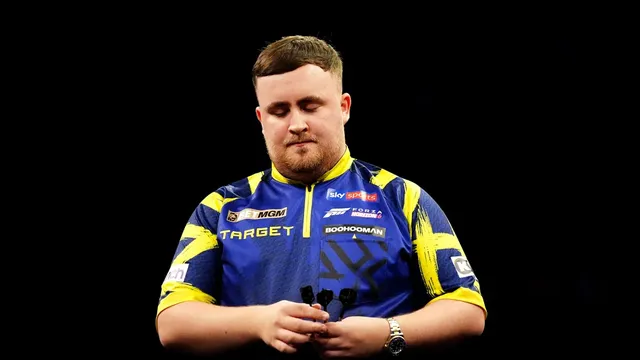 Darts champion Luke Littler loses to Luke Woodhouse in first round of World Grand Prix in Leicester, England