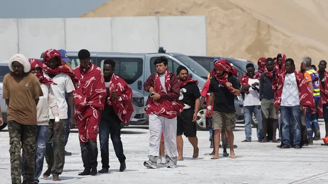 Mega-dinghy fire forces 157 migrants into sea