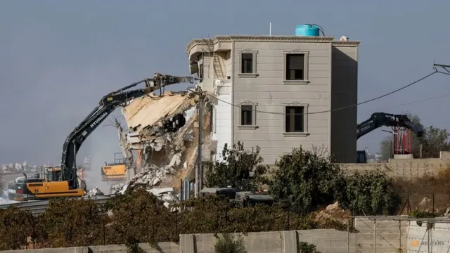 Israel orders West Bank closure after soldiers kill two Palestinians in alleged attack
