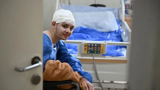 German doctors treat Palestinian Ahmed al-Chair in Cairo after he was shot in the head in Gaza