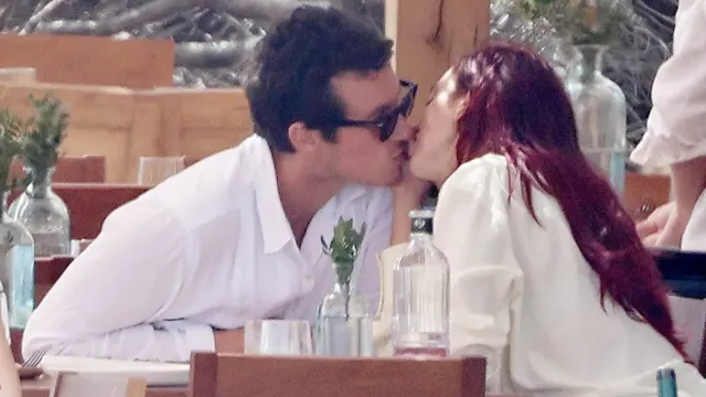 Dua Lipa and Callum Turner share a kiss during Ibiza getaway