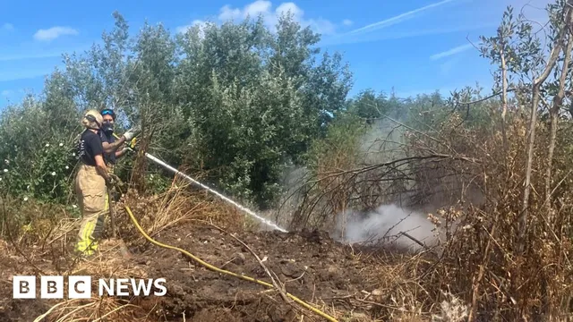 Firefighters battle blaze at illegal waste dump in Trafford