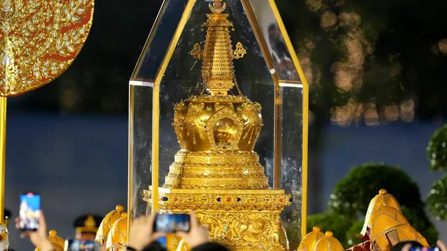 Thousands rally in Bangkok to honor Buddha relic on royal birthday