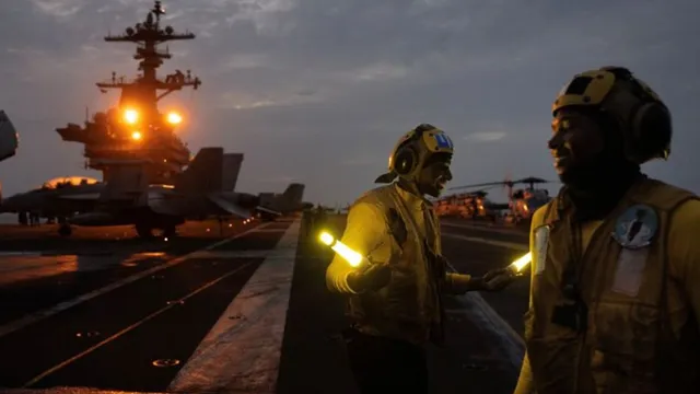 US aircraft carrier USS George Washington crew adjusts to wartime operations near Strait of Hormuz