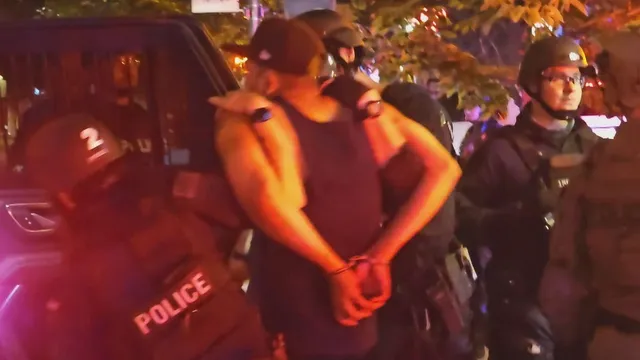 Denver police arrest 18 marchers amid immigration protest chaos