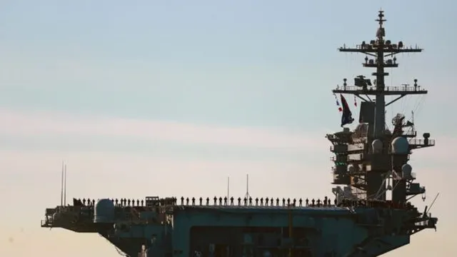 US commander visits carrier in Arabian Sea as Mideast tensions persist