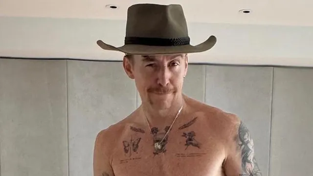 Danny Jones shows off his abs after winning King Of The Jungle