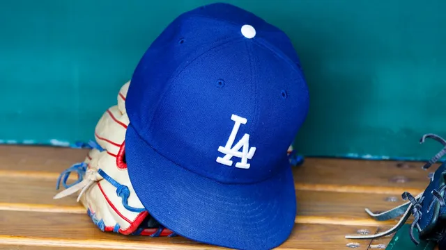 Dodgers cut 12 players as spring training roster reshuffles