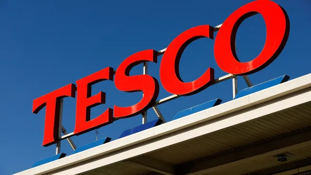 Tesco reduces profit forecast as supermarket competition intensifies