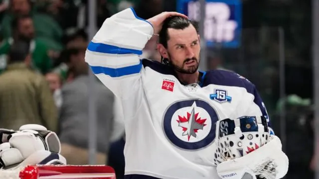 Winnipeg Jets suspend goaltender Connor Hellebuyck for skipping training camp in Canada