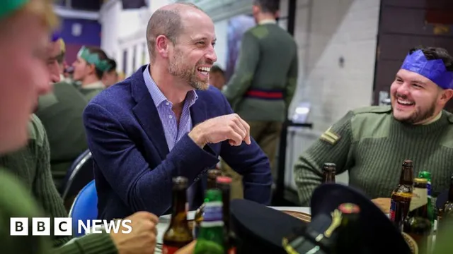 Prince William serves pudding at Welsh Guards' Christmas celebration
