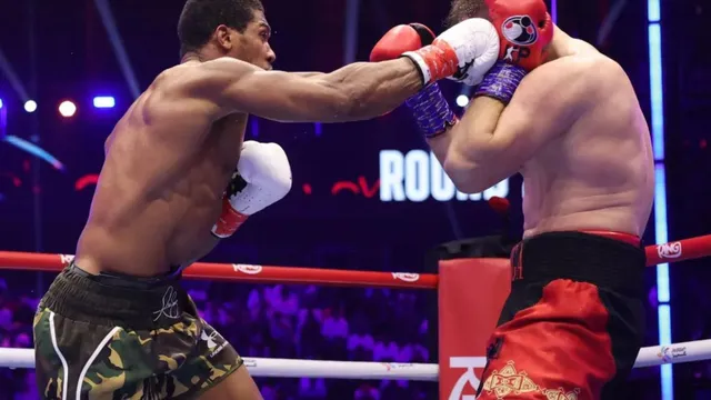Anthony Joshua survives knockdowns to secure victory against Kristian Prenga