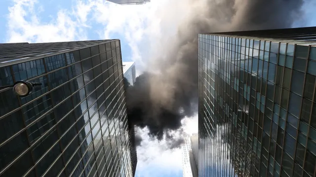 Fire erupts in Manhattan high-rise but parade remains unaffected