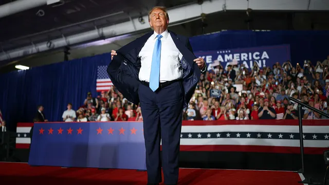 US President Donald Trump reveals his suit is from affordable brand Jos. A. Bank at Nebraska rally