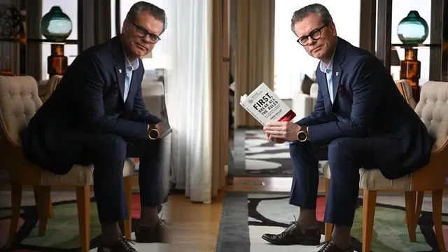 Karl Hudson showcases his love for reading and leadership through his library