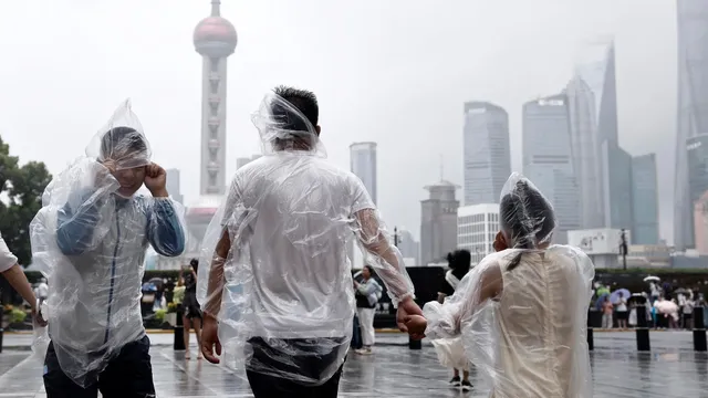 Typhoon Dolphin floods Shanghai streets and disrupts air travel