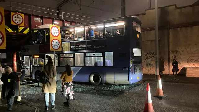 Passengers trapped as double-decker bus crashes into Glasgow bridge