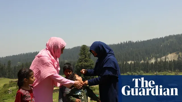 Women vaccinate children against polio in remote Kashmir