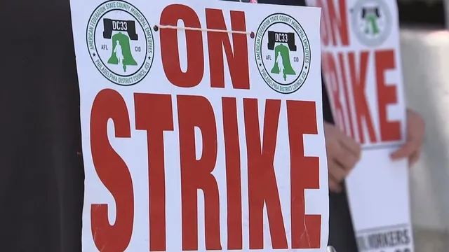 Driver charged after hitting two sanitation workers on strike in Philadelphia