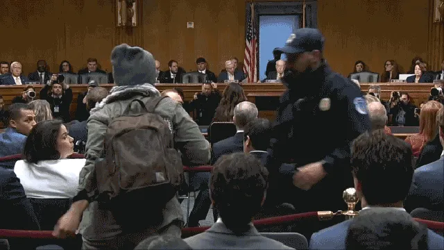 Protester confronts Kristi Noem during Senate hearing on immigration