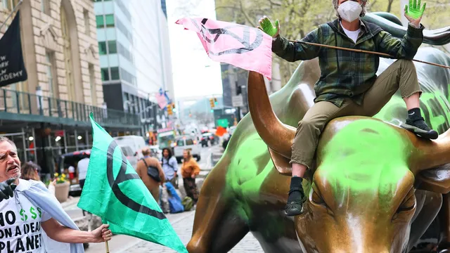 Climate activists vandalize Wall Street Bull with powerful message